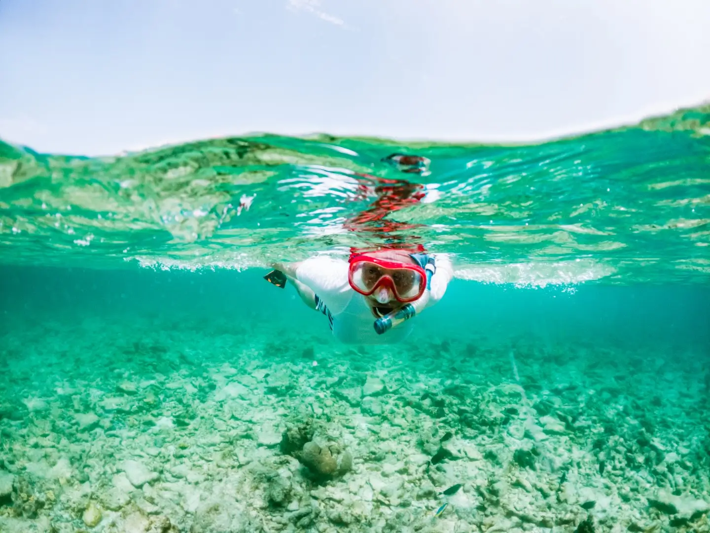 A woman snorkels in one of the top places in Aruba.