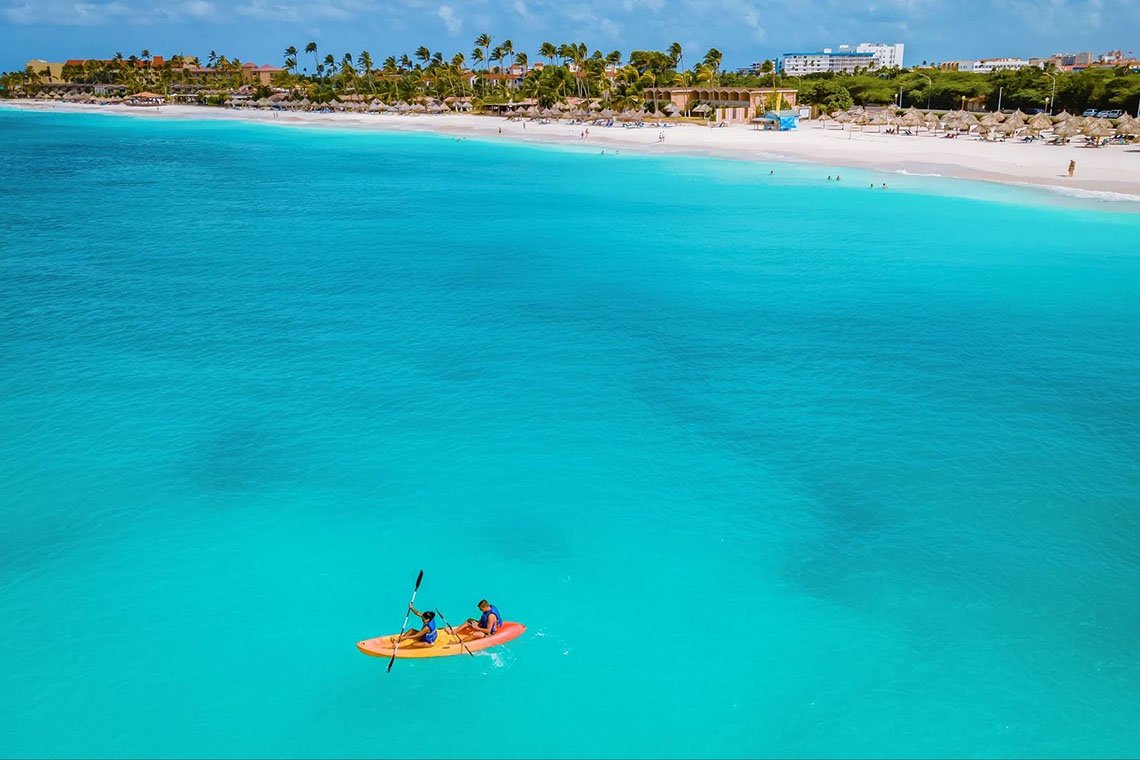 A couple kayaking on one of Aruba's beaches.