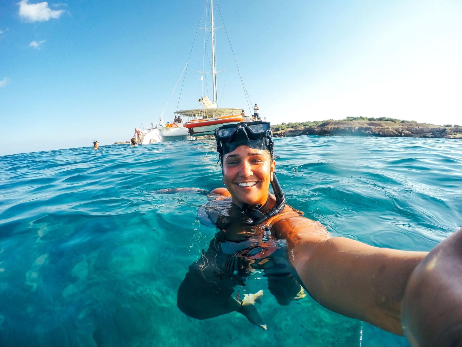 A woman takes a selfie after snorkeling in Aruba's waters. 