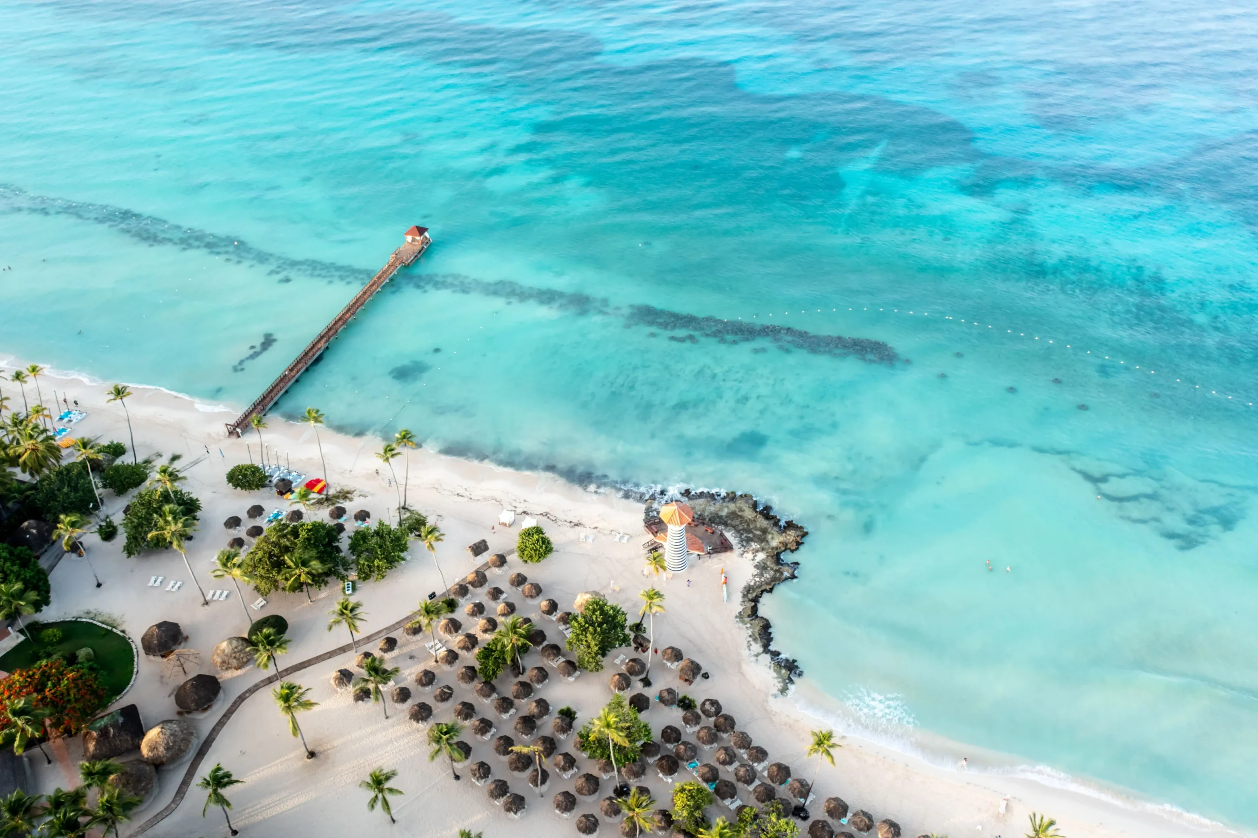 pier clear blue ocean and beach