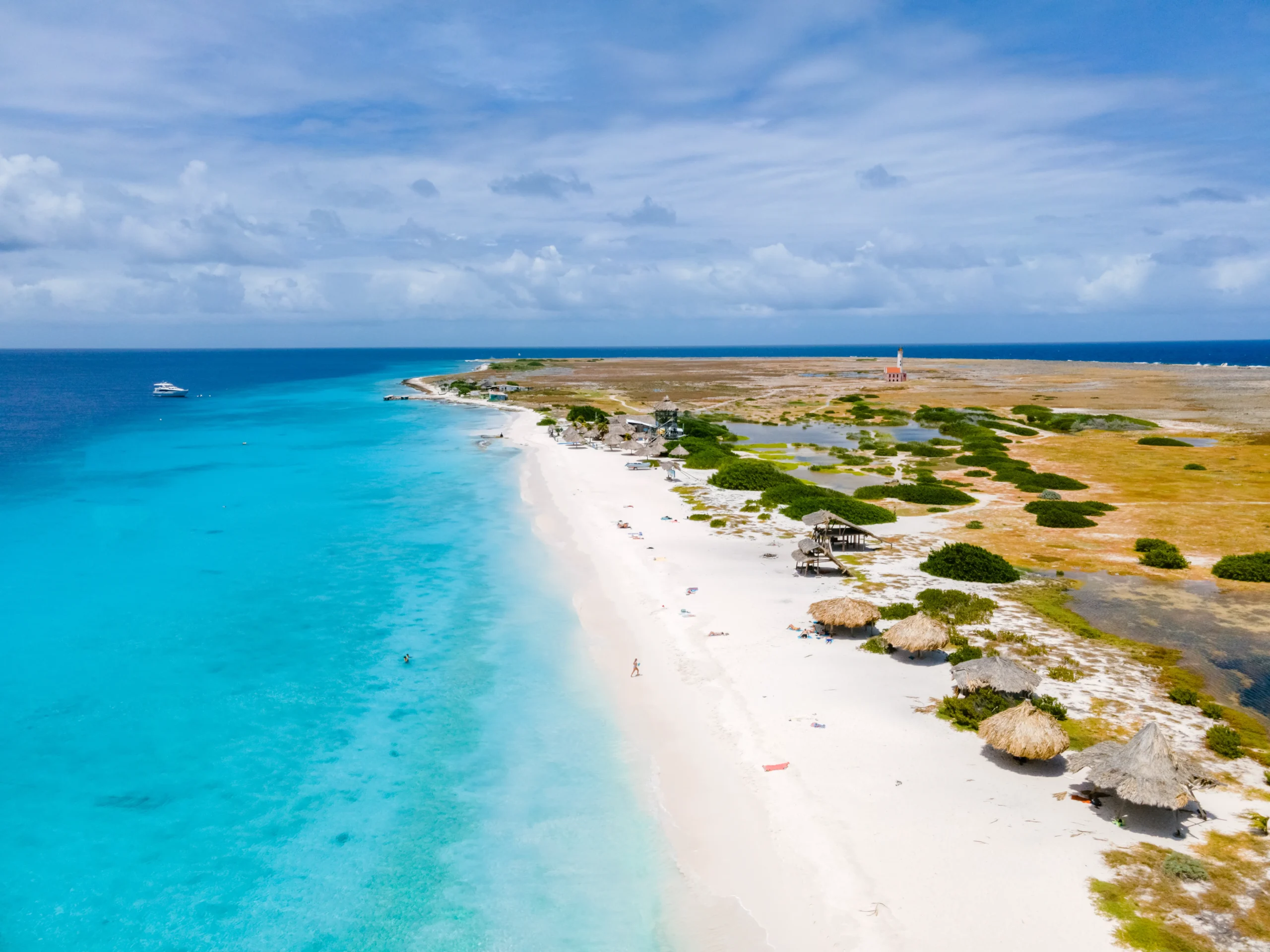 Shoreline with white sand beach and blue water